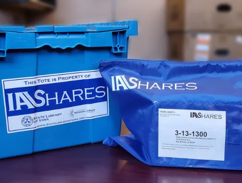 Image of official IA Shares blue bag and tote.