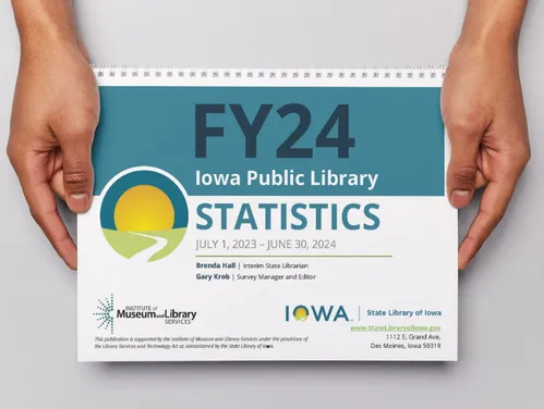 Hands holding a print copy of the Public Library Annual Statistics publication.