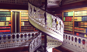 Detail of the Law Library spiral staircase highlighting the white lacy ironwork.