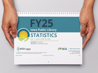 Hands holding a printed copy of the Public Library Annual Statistics publication.