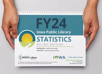 Hands holding a print copy of the Public Library Annual Statistics publication.